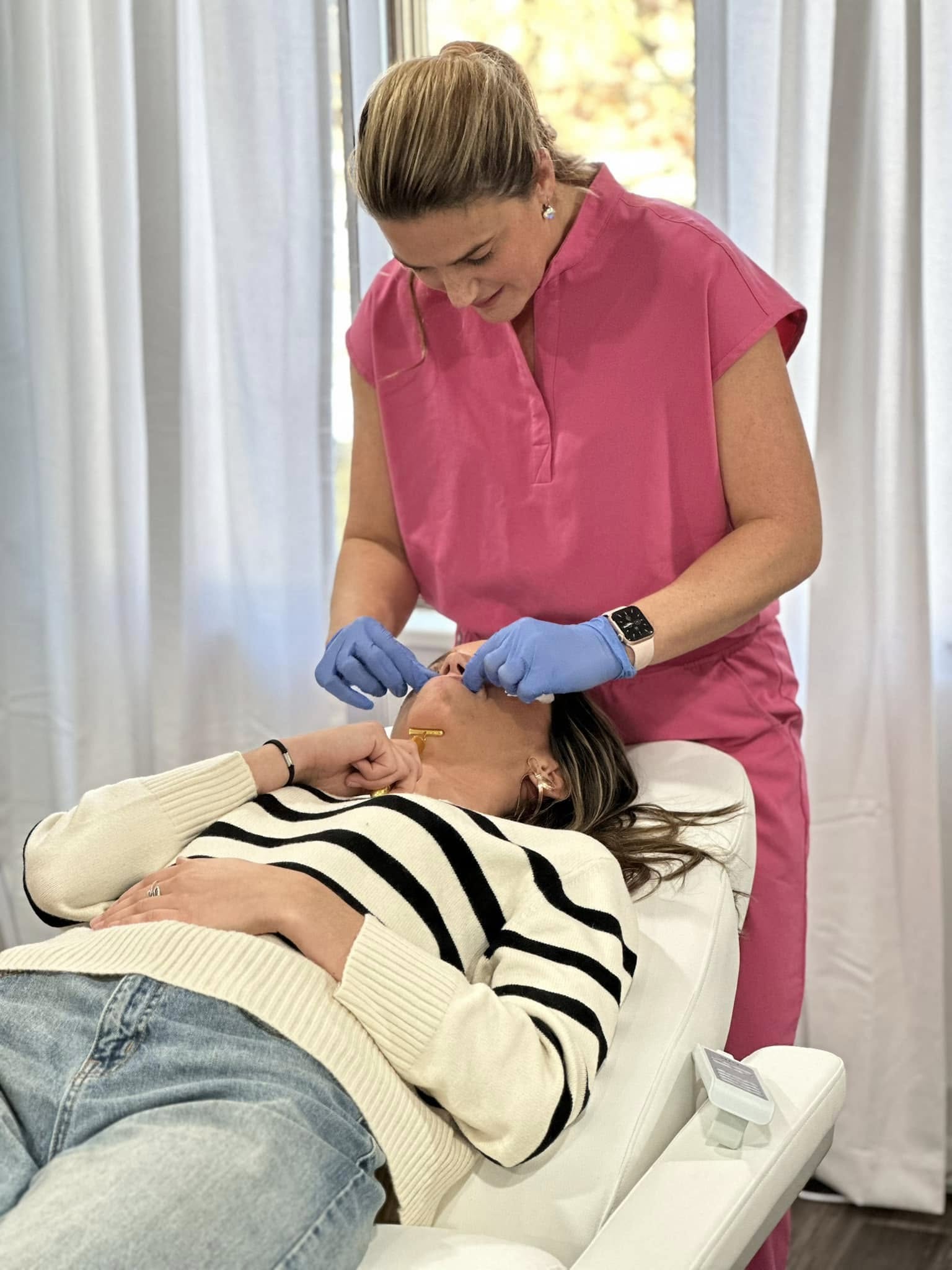 A provider treating a patient in a treatment room